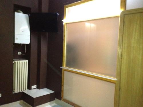 A television and/or entertainment centre at 44 Centro Apartaments & Suites