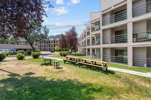 a group of benches in front of a building at The Christie Lodge – All Suite Property Vail Valley/Beaver Creek in Avon