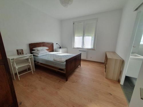 a white bedroom with a bed and a window at Ferme de la felicità in Montbarla