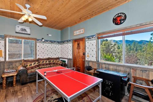 a living room with a ping pong table in it at Yosemite Pines Cabin - Sleeps 6 in Big Bear Lake