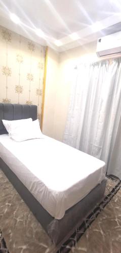 aladdin hotel Egypt Badrにあるベッド