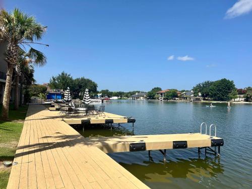 a dock with benches on the side of a lake at Horseshoe Bay Townhome w Water Access in Horseshoe Bay