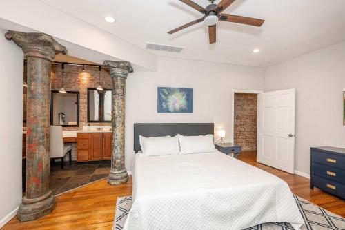 a bedroom with a bed and a ceiling fan at Sweet Escape in Cincinnati