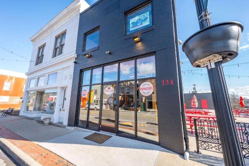 a building on the corner of a city street at Arkstone Retreat 1 - Chic Downtown Escape in Williamstown