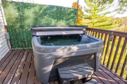 a grill sitting on a deck with a pool of water at Cozy Home Away From Home in Florence