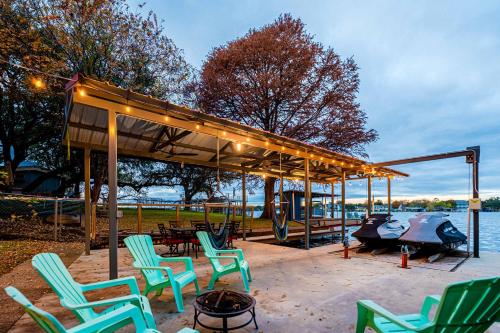 a gazebo with chairs and a table and a grill at Lake LBJ Waterfront Family-Friendly Retreat in Granite Shoals