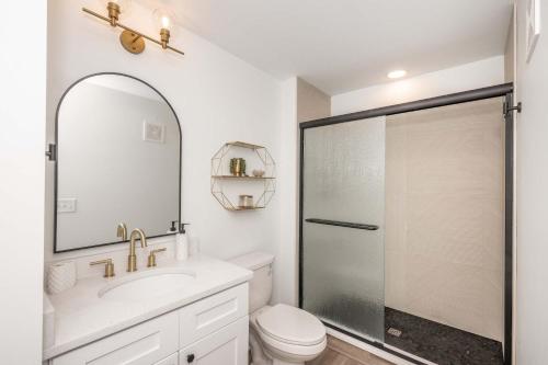 a bathroom with a shower and a sink and a toilet at New Listing - Covington Charm Suites in Covington