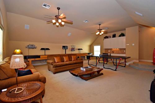 a living room with couches and a table at Pet-Friendly Oasis in Gated Community in Spicewood