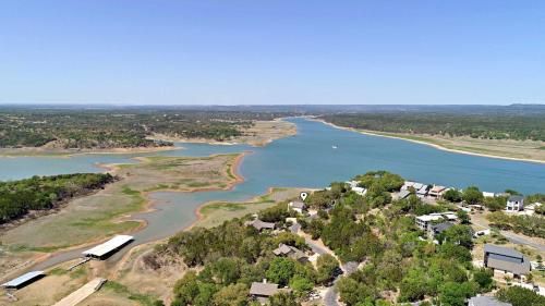 an aerial view of a river with houses and trees at Pet-Friendly Oasis in Gated Community in Spicewood