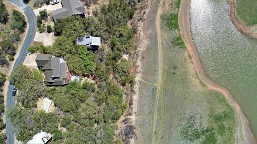 an aerial view of a house next to the water at Pet-Friendly Oasis in Gated Community in Spicewood