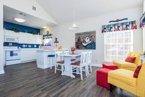 a kitchen and living room with a table and chairs at Pet Friendly Retreat on Lake LBJ in Burnet