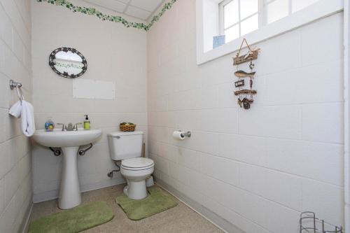 a bathroom with a toilet and a sink at Pet Friendly Retreat on Lake LBJ in Burnet