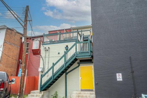 a building with a staircase on the side of it at The Heart of Madison 3 in Covington