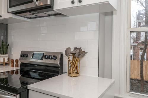 a kitchen with a stove and a counter top at LUXE Spot 2 in Covington