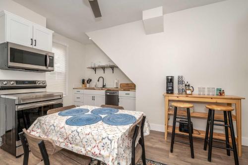 a kitchen with a table with blue plates on it at Historic Ludlow Apt A in Ludlow