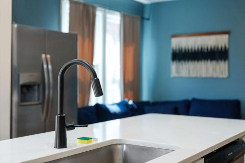 a kitchen with a sink and a counter top at Merion Village Residences - Peaceful Columbus Neighborhood in Columbus