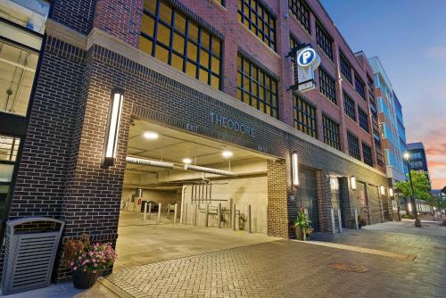 a large brick building with a parking garage at Bridge Park Luxe in Dublin