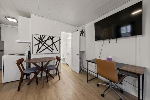 a kitchen and dining room with a table and chairs at Chic City Retreat 99 For 2 in Columbus