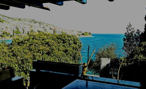 a view of a body of water with the ocean at Beach House Bella Vista apartments in Trogir