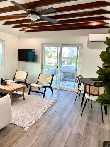 a living room with a table and chairs at Blue Water in Southampton