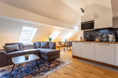 a living room with a couch and a table at Vila Slovenka in Celje