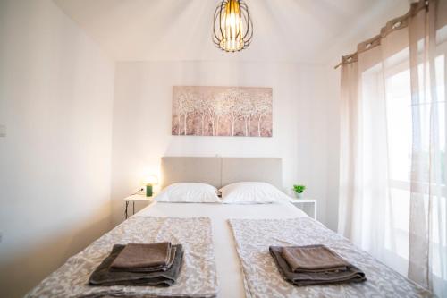 Ένα ή περισσότερα κρεβάτια σε δωμάτιο στο Apartmani B&S