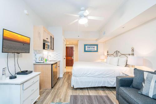 a hotel room with a bed and a couch at Seashell Shuffle at Sandestin Pilot House in Destin