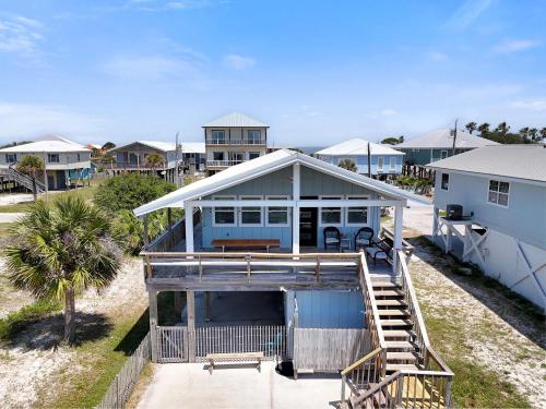an aerial view of a house with a porch at Bungalow by the Bay with FREE ACTIVITIES in Gulf Shores
