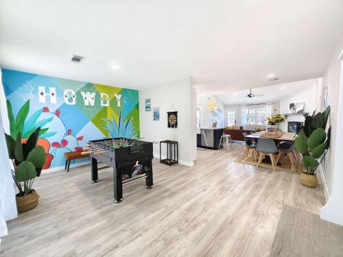 a living room with a ping pong table in the middle at Sageview Cottage - 4 BDR with Pool Pet Friendly in Houston