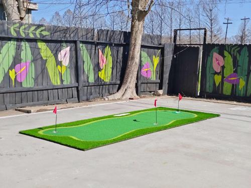 a miniature golf course in a parking lot at Sageview Cottage - 4 BDR with Pool Pet Friendly in Houston