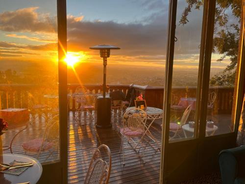 a balcony with a view of the sunset at Lokanga Boutique Hotel in Antananarivo