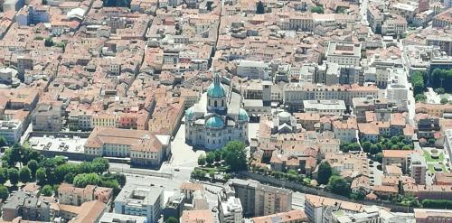 an aerial view of a city with a building at Wellness Holiday Home in Brunate