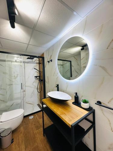 a bathroom with a sink and a mirror at Flamenco Ambar Luxury Apartment 15 Planta in Calpe