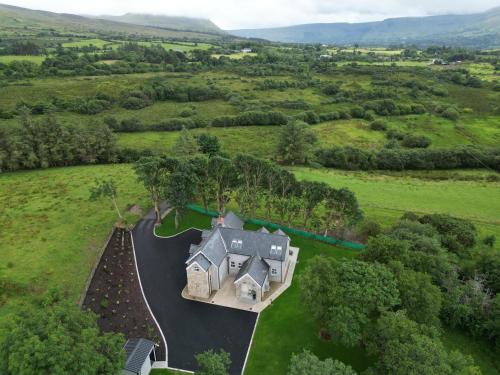 an aerial view of a house in a field at Moneen Mountain View in Kinlough