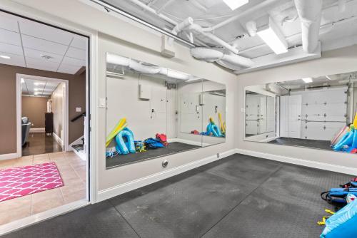 a room with four sliding glass doors with games at Leeloo's on the Lake - Sleeps 12 in Lexington