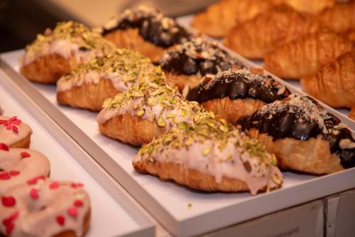 a display case of donuts with sprinkles on them at Fairfield by Marriott Goa Benaulim in Benaulim