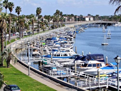 a bunch of boats are docked at a marina at Sand Sun & Second - Charming Studio within Walking Distance to Beach in Long Beach