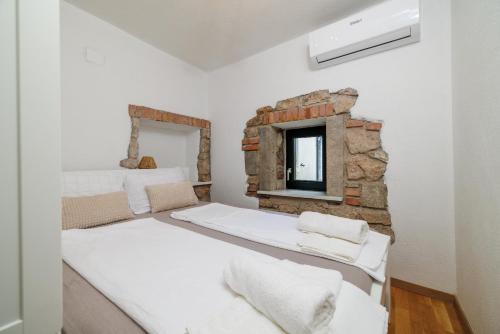 Postel nebo postele na pokoji v ubytování Niluma