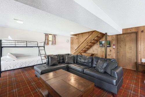 a living room with a couch and a bed at Boondock Bliss - Lakefront with Private Dock Sleeps 15 in Sunrise Beach