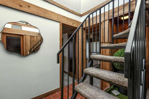 a view of a staircase with a metal railing at Cedar Nest - Experience Ozark Magic in Sunrise Beach in Sunrise Beach