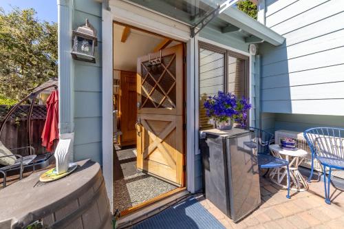 a door leading to a patio with a table and chairs at Snuggle Inn - A Romantic Retreat in Carmel