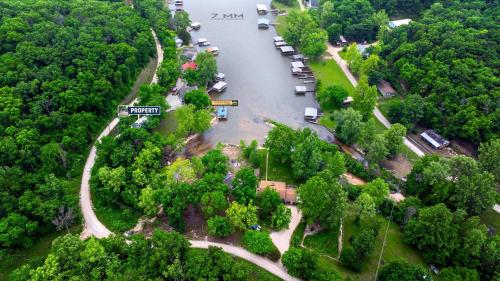 an aerial view of a river with cars parked next to trees at Cozy Cove Cabin - The Perfect Ozark Retreat in Roach