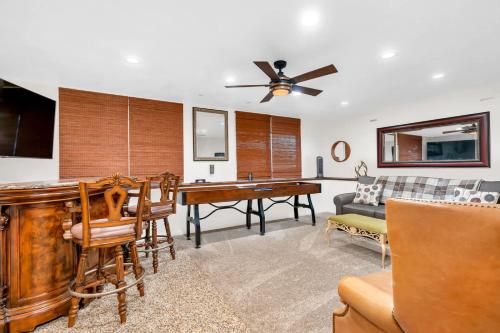 a living room with a table and a couch at CC Cabin - Full Game Room & Wrap Around Deck in Shaver Lake