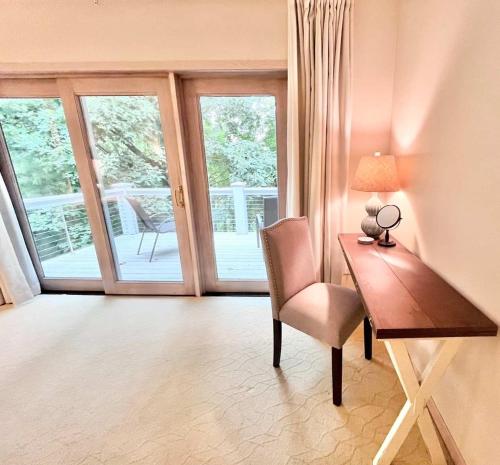 a desk with a chair and a lamp in a room at Spacious 4 BDR Home in Desirable Abbey Springs in Lake Geneva