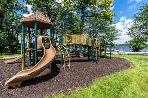 a playground with a slide in a park at Spacious 4 BDR Home in Desirable Abbey Springs in Lake Geneva