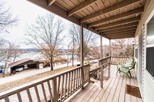 a porch with a view of the water at Osage Beach Getaway - Lake Views & Pet Friendly in Osage Beach