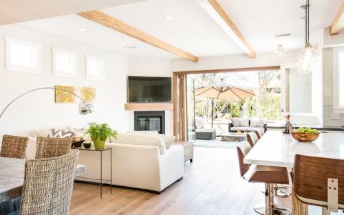 a living room with a couch and a table at A True Vacation Masterpiece in Corona del Mar