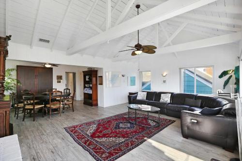 a living room with a couch and a table at Grand Canal Getaway - Balboa Island in Newport Beach