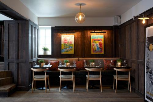 a dining room with a table and chairs at Artist Residence Bristol in Bristol