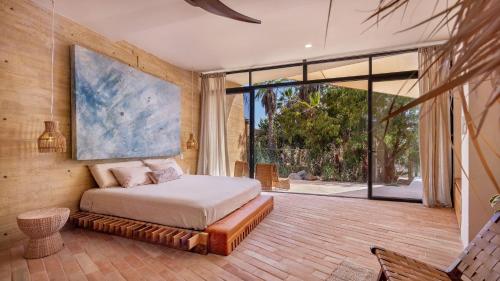 Ένα ή περισσότερα κρεβάτια σε δωμάτιο στο WAMA Boutique Hotel